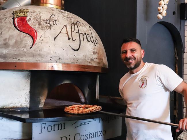 Pizzeria da Alfredo co-owner Alfredo Repole making a wood-fire pizza. Picture: Jenifer Jagielski