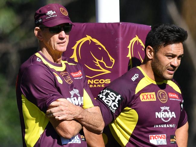 Broncos coach Wayne Bennett (left) and Alex Glenn (right) are seen during a Brisbane Broncos training session at Clive Berghofer Field in Brisbane, Wednesday, August 8, 2018. The Broncos are playing their round 22 NRL match against the North Queensland Cowboys on Thursday night in Townsville. (AAP Image/Darren England) NO ARCHIVING