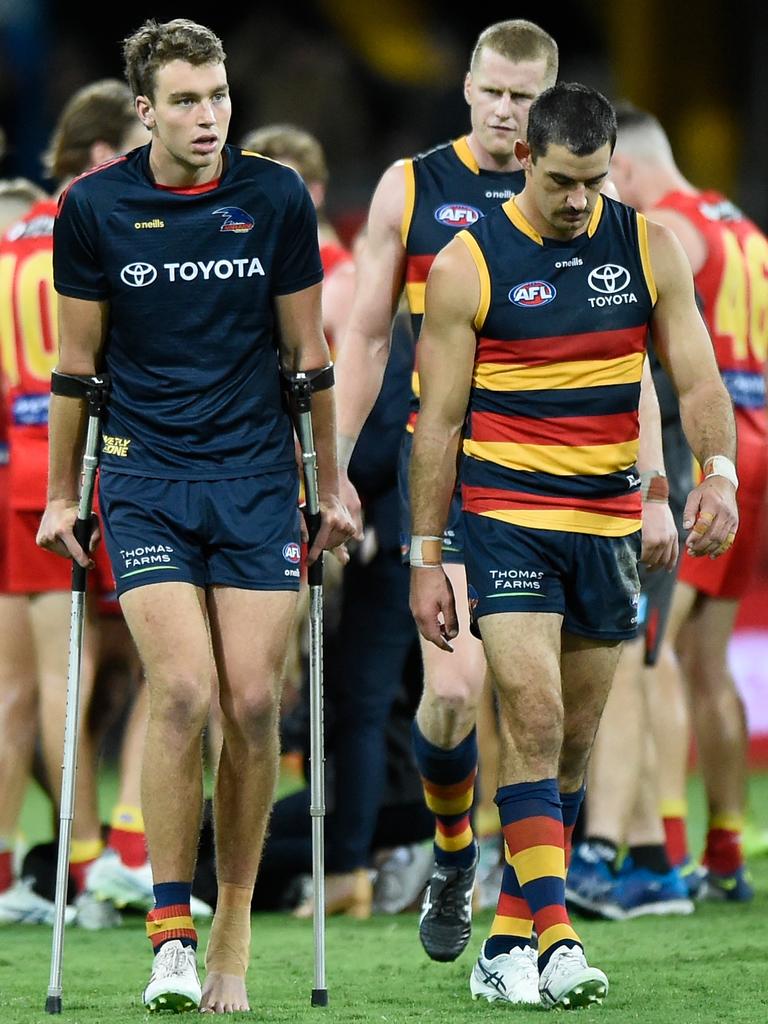 Big Crow Riley Thilthorpe on crutches post-match. Picture: Matt Roberts/AFL Photos/Getty Images