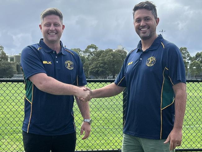 Michael Hill with Yarraville captain-coach Mitch Johnstone.