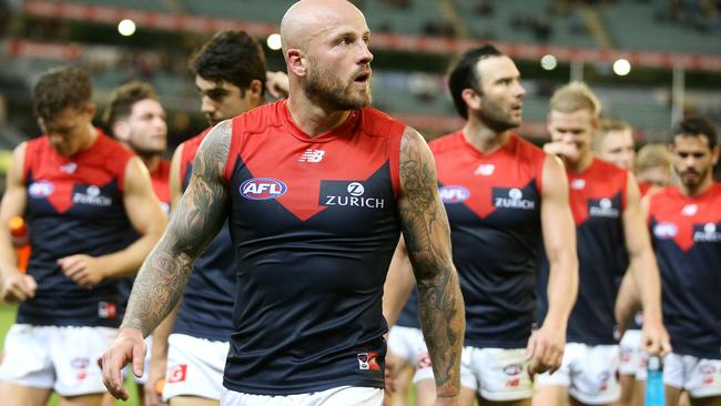 Melbourne skipper Nathan Jones leads the Demons off the MCG. Picture: Michael Klein