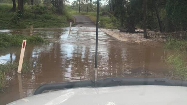 A flooded crossing at Glastonbury Creek where 90mm fell overnight, stopped residents from passing. Photo: Casey Turner