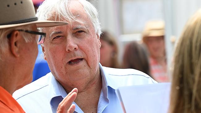 27/10/2020 : Clive Palmer during a press conference  with his candidate Steven Newbery , then handing out how to vote cards at a pre poll while on the hustings in the marginal electorate of Pumicestone,  north of Brisbane at Bribie Island for the upcoming QLD state election. Pic Lyndon Mechielsen