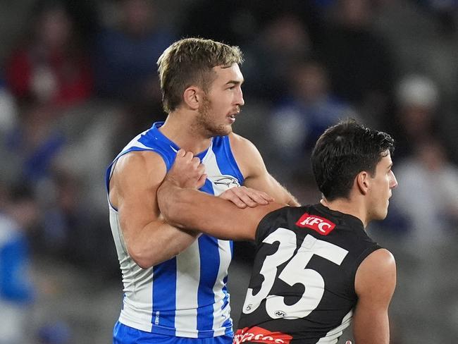 MELBOURNE, AUSTRALIA - JUNE 16: Will Phillips of the Kangaroos and Nick Daicos of the Magpies compete during the round 14 AFL match between North Melbourne Kangaroos and Collingwood Magpies at Marvel Stadium, on June 16, 2024, in Melbourne, Australia. (Photo by Daniel Pockett/Getty Images)