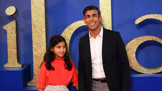 Rishi Sunak, with his daughter, is seen as a potential unity candidate. Picture: AFP