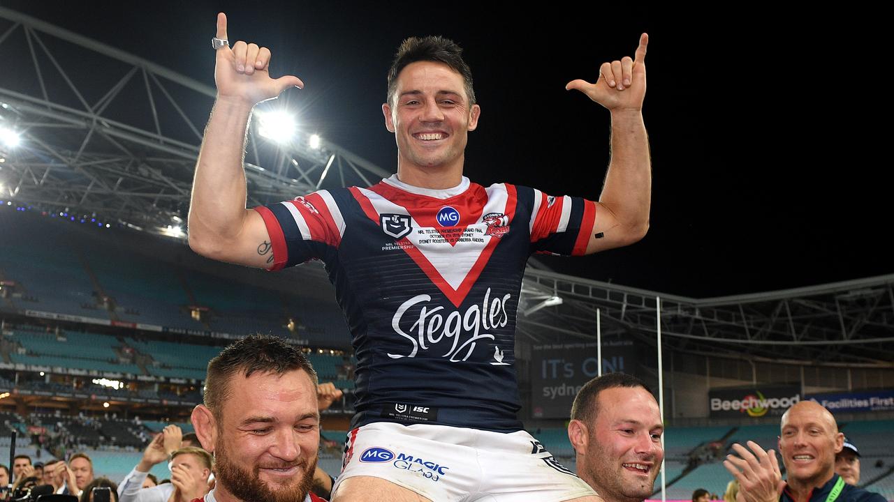 Cooper Cronk of the Roosters is chaired off following their win over the Raiders