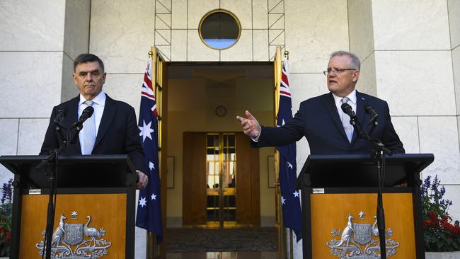 Australian Prime Minister Scott Morrison (right) and Australia's Chief Medical Officer Brendan Murphy speak to the media during a press conference at Parliament House in Canberra, Wednesday, March 18, 2020. (AAP Image/Lukas Coch) NO ARCHIVING