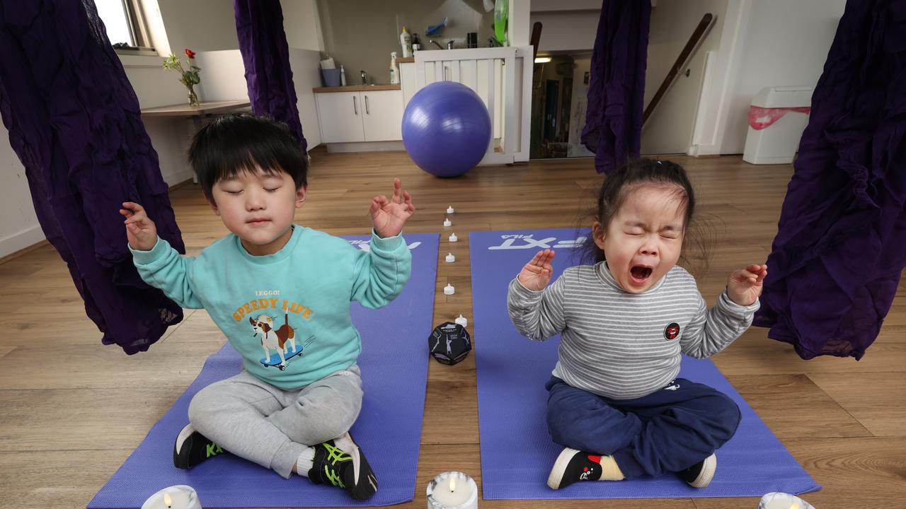 Kinder kids Shiu 4 and Larissa 4 relax in a meditation and yoga room at Essex Heights Juniors. Picture: David Caird