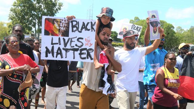 Algen Donahue leads a march through the streets of Mareeba after his twin brother was shot dead by police. Picture: Peter Carruthers