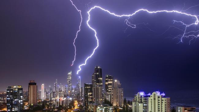 Gold Coasters are being urged to remain vigilant and keep an eye out for changing conditions. Double lightning strike on the Gold Coast, Q1 and a crane, 2021. Picture: Renee Doyle / Severe Weather Australia