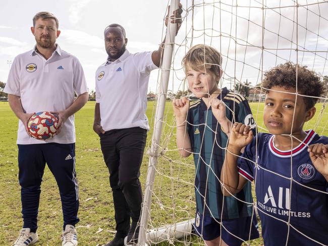 October 13 2022: Tom Quinn and Peter Mazalla with their kids, Fred (8) and Zion (7) want to give kids a chance to play soccer.   Picture: Kelly Barnes