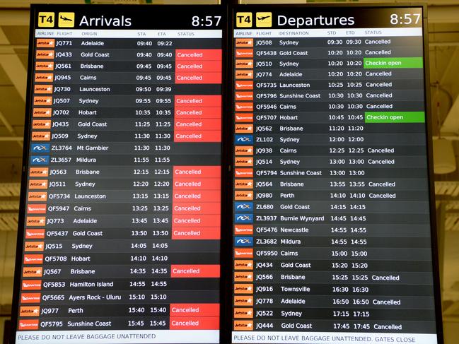 A list of cancelled flights at Melbourne Airport on Wednesday morning. Picture: Andrew Henshaw