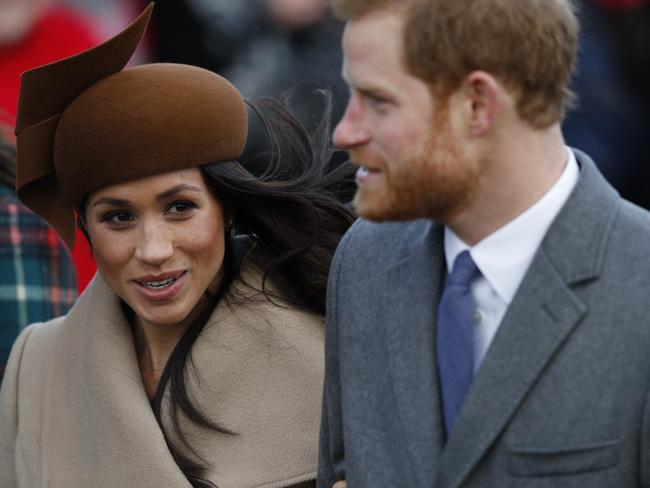 (FILES)  (L-R) US actress and fiancee of Britain's Prince Harry Meghan Markle and Britain's Prince Harry arrive to attend the Royal Family's traditional Christmas Day church service at St Mary Magdalene Church in Sandringham, Norfolk, eastern England, on December 25, 2017. (Photo by Adrian DENNIS / AFP)