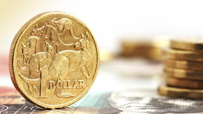 Aussie one dollar coins, on a twenty dollar note.