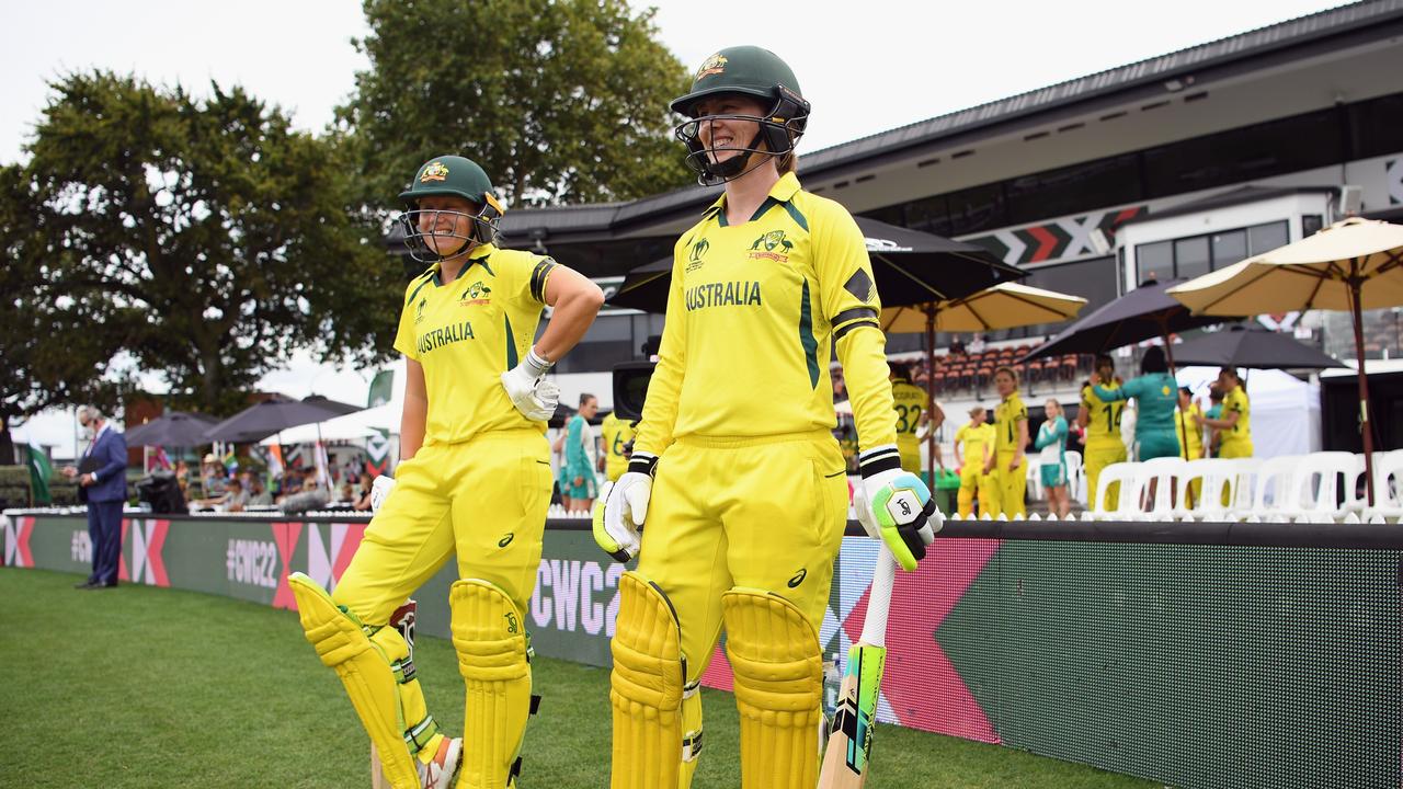 Alyssa Healy and Rachael Haynes of Australia walk out to bat wearing black armbands during the Women's Cricket World Cup match against England. (Photo by Kai Schwoerer/Getty Images)