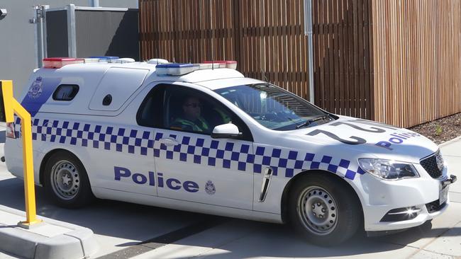 A police car believed to be transporting the 27 year old woman involved in the missing boy case leaves Echuca Police Station on Friday, March 3, 2017, in Echuca, Victoria, Australia. Picture: Hamish Blair