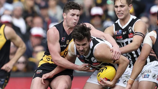 SANFL - GRAND FINAL  22/09/19 - Port Adelaide v Glenelg at Adelaide Oval. Sam Mayes under pressure from Bradley McCarthy Picture SARAH REED