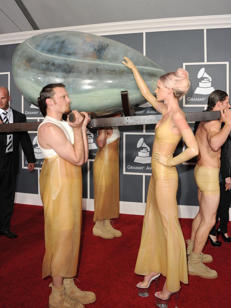 When you’re too famous to even walk the red carpet ... what’s left to do but arrive in an egg, carried by your art-scene underlings of course. Lady Gaga arrives at the 2011 Grammys. Picture: Getty