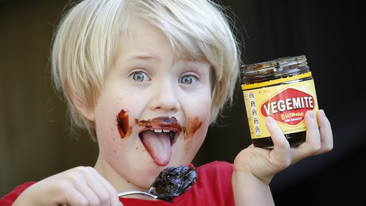 Many Australians, including six-year-old Alex, love the taste of Vegemite, but the smell of the spread being made is also important to the cultural heritage of a Melbourne suburb. Picture: David Caird