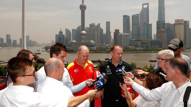 Rodney Eade and Ken Hinkley speak to the media in China.