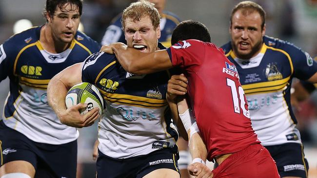 CANBERRA, AUSTRALIA - FEBRUARY 13: David Pocock of the Brumbies is tackled during the round one Super Rugby match between the Brumbies and the Reds at GIO Stadium on February 13, 2015 in Canberra, Australia. (Photo by Stefan Postles/Getty Images)