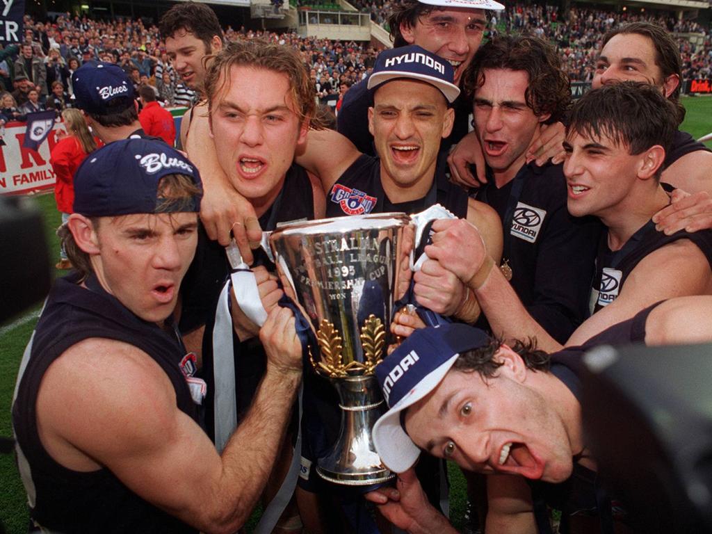 Anthony Koutoufides and teammates celebrate the 1995 Grand Final win.