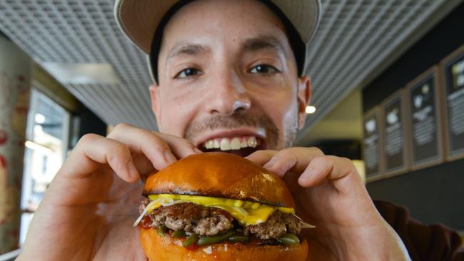 Burger Theory co-owner Dan Mendelson with the new kangaroo beef blend cheese burger. Brenton Edwards/AAP