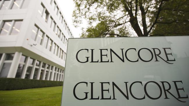 The logo of Glencore is seen in front of the company's headquarters in the Swiss town of Baar in this September 7, 2012 file photo. Concern about U.S. monetary policy and slowdown in emerging markets led by China has hit commodities markets and related stocks like Glencore last week and ramped up volatility. REUTERS/Michael Buholzer/Files GLOBAL BUSINESS WEEK AHEAD PACKAGE - SEARCH "BUSINESS WEEK AHEAD OCTOBER 5" FOR ALL 29 IMAGES