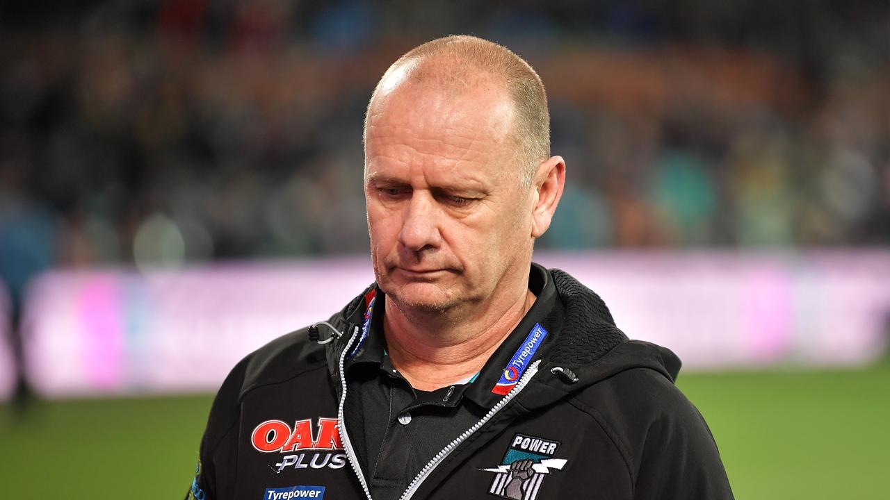 Ken Hinkley walks from the field looking dejected.