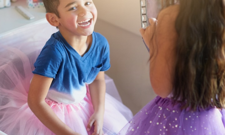 boy getting dressed for school