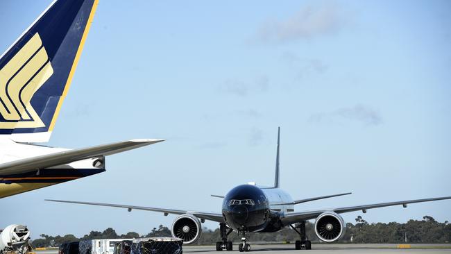 An Air New Zealand plane taxies past a Singapore Airlines plane at Melbourne Airport last week. Melbourne Airport chief executive Lorie Argus says it is an exciting but challenging time for the industry. Picture: Andrew Henshaw