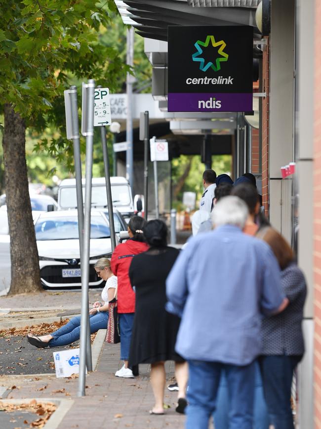 A queue of people outside a Centrelink office. Picture: AAP