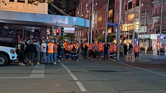 A group of protesters were pictured on the corner of Bourke and Swanston Streets in Melbourne. Picture: Reddit.