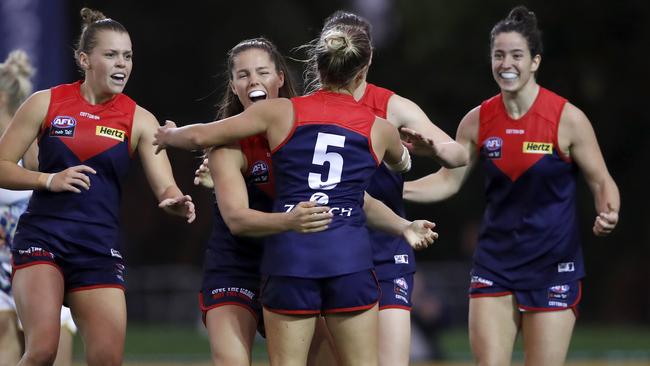 Tyla Hanks (No.5) is mobbed by teammates after a goal. Picture: AFL Photos via Getty Images