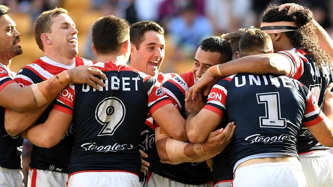 James Tedesco celebrates a try with his Roosters teammates at Suncorp Stadium. Picture: Getty Images