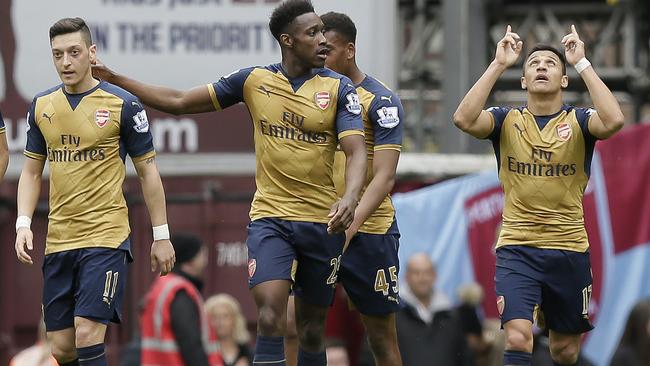 Arsenal's Alexis Sanchez, right, celebrates after scoring a goal, with Arsenal's Mesut Ozil.