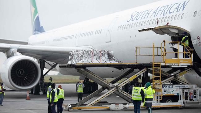 Workers unload the second shipment of the Johnson &amp; Johnson Covid-19 coronavirus vaccine from a plane upon its arrival in Johannesburg on February 27. Picture: AFP