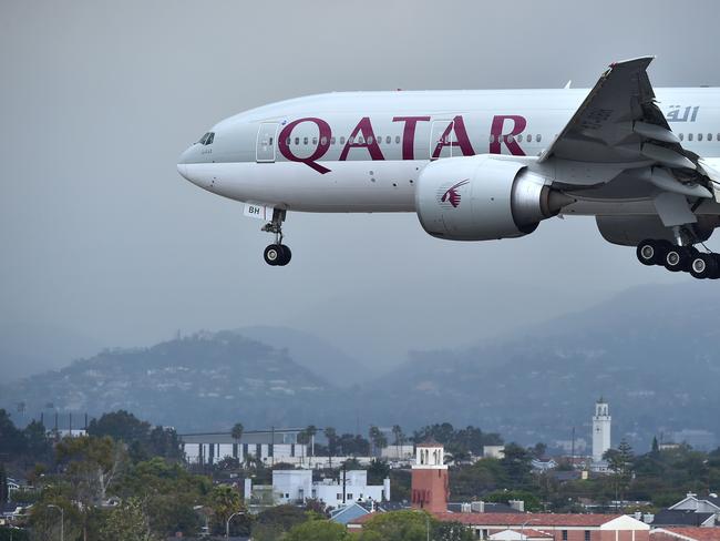 (FILES) This file photo taken on March 21, 2017 shows a Qatar Airways aircraft coming in for a landing at Los Angeles International Airport. Gulf states on June 4, 2017 cut diplomatic ties with neighbouring Qatar and kicked it out of a military coalition, less than a month after US President Donald Trump visited the region to cement ties with powerhouse Saudi Arabia. Egypt's foreign ministry also accused Doha of supporting "terrorism" and announced the closure of its ports and airports to Qatari carriers. / AFP PHOTO / FREDERIC J. BROWN