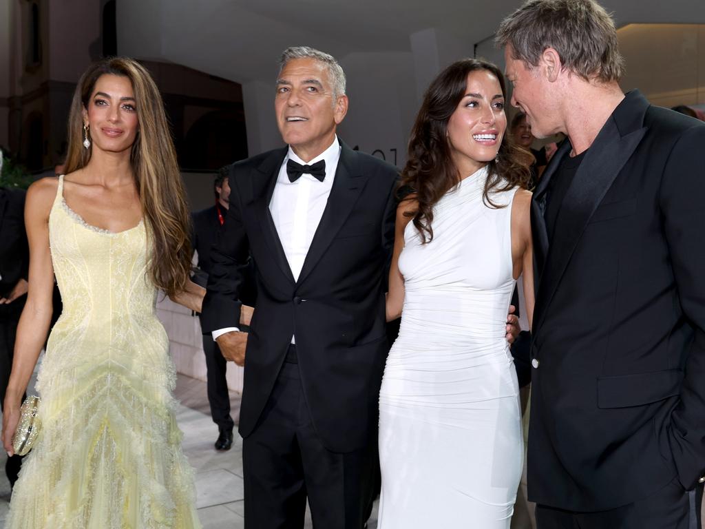 The four looked close as they posed for photographers. Picture: Pascal Le Segretain/Getty Images