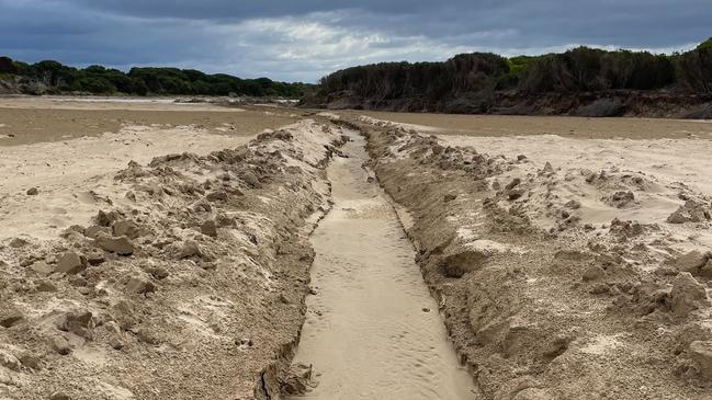 An illegal estuary opening in the Thompson Creek estuary at Breamlea. Picture: Corangamite Catchment Management Authority