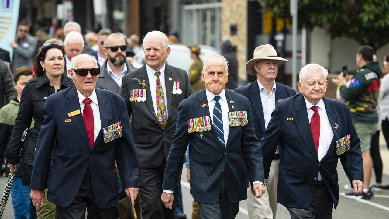 Glenn Trussell, formerly of 547 signal troop (centre) marching with fellow Vietnam vets in the Anzac Day morning march, Monday, April 25, 2022. Picture: Kevin Farmer