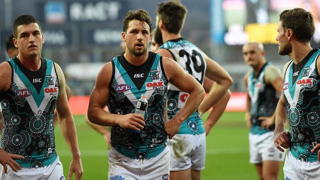 Disappointed Port Adelaide players leave the field on Saturday. Picture: AAP Images