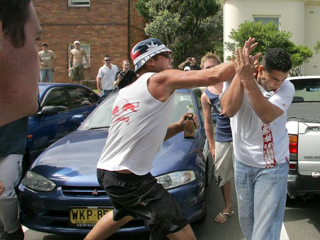 A young Middle Eastern man is set upon by up to 20 drunken rioters in North Cronulla Beach carpark. Picture: Adam Ward