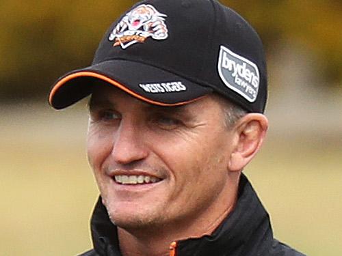 Wests Tigers NRL coach Ivan Cleary with Moses Mbye during a closed training session at Concord Oval, Sydney. Picture: Brett Costello