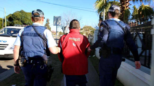 A man is arrested by NSW Police at a residence in Cabramatta as part of a wider raid on a tobacco smuggling syndicate.