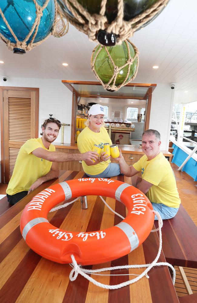 There is a new venue on the Gold Coast Called Holy Ship. They have converted two 1970 timber trawlers to a bar and restaurant that operate side by side on the Broadwater. Owners Jake Ruttley, Yvette McCarthy and Kane McCarthy toast their success. Picture Glenn Hampson