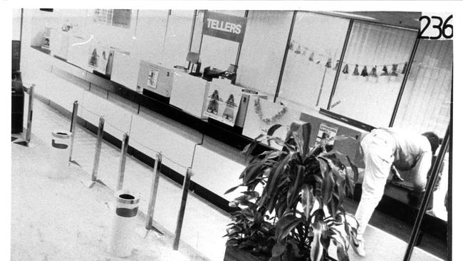 An image from a security camera inside the Australia Post building on Queen Street showed Frank Vitkovic climbing over a counter during his 1987 rampage. Photo: supplied