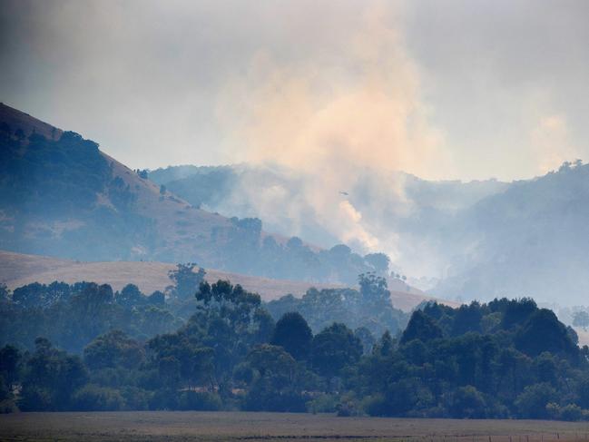 YEA, FEBRUARY 22, 2023: A grass fire smoulders north of Flowerdale. Picture: Mark Stewart