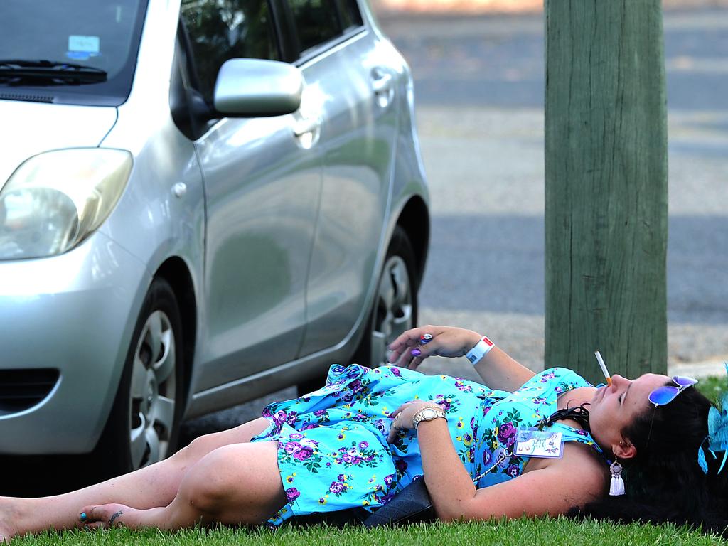 One racegoer at Doomben in Brisbane. Picture: AAP/John Gass