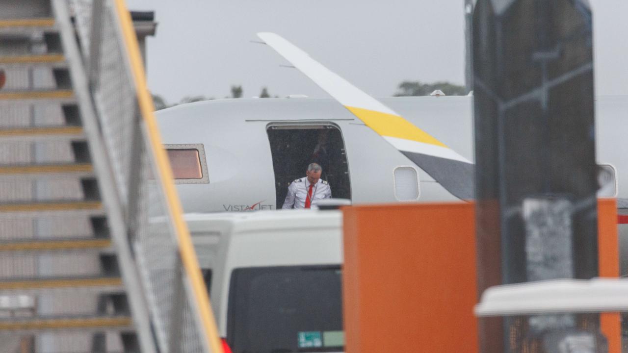 A crew member on the jet was briefly seen before the plane went into the airport’s hangar. Picture: NCA NewsWire / David Swift